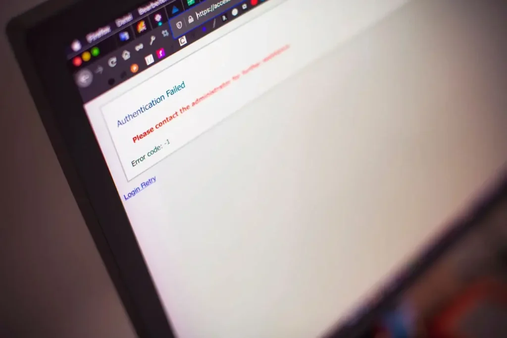 Close-up of a laptop screen displaying an authentication failed error message