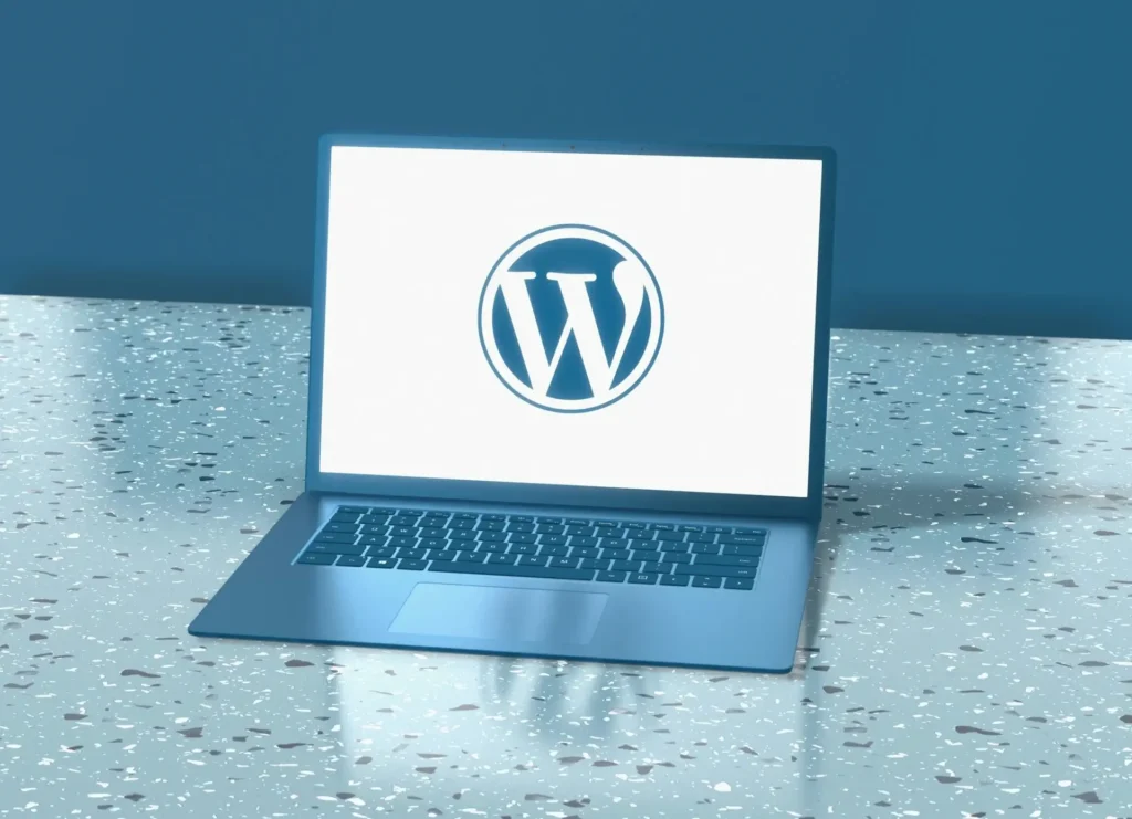 Laptop displaying the WordPress logo on its screen